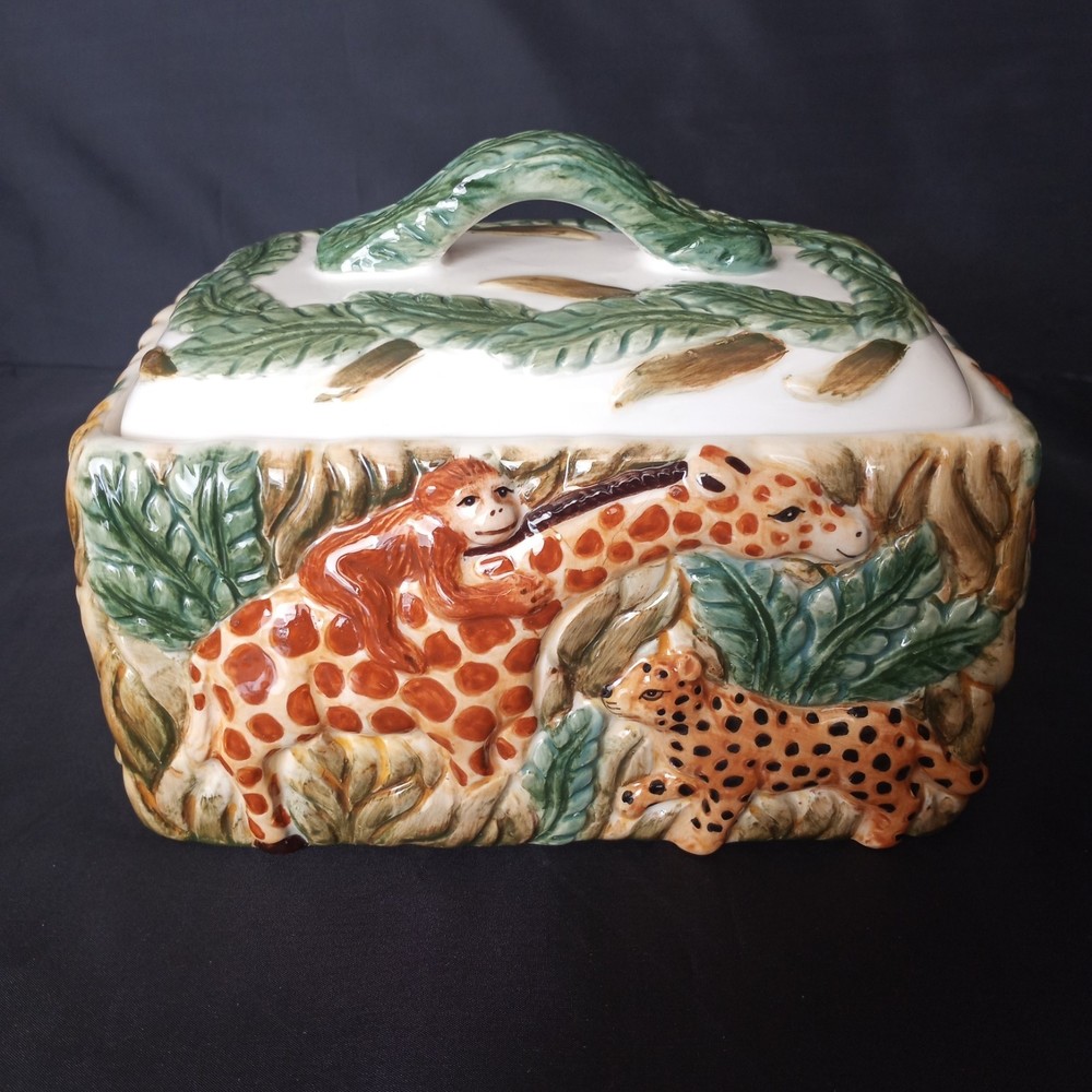 Trinket box with Monkey riding a giraffe, elephant, zebra and leopard.